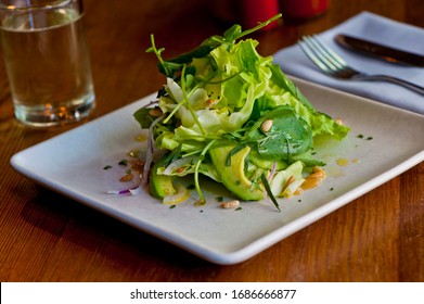 Caesar Salad. Classic American Salad With Romaine, Caesar Dressing, Red Onions, Bacon Lardons, Parmesan Cheese, Olive Oil, Lemon Juice, Salt And Pepper. A Fine Dining Restaurant Classic.