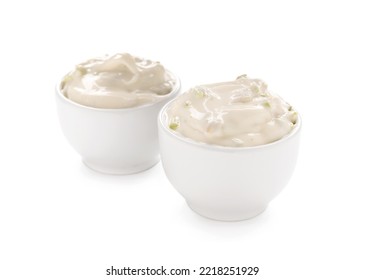 Caesar Salad Dressing In Bowls On White Background