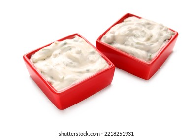 Caesar Salad Dressing In Red Bowls On White Background