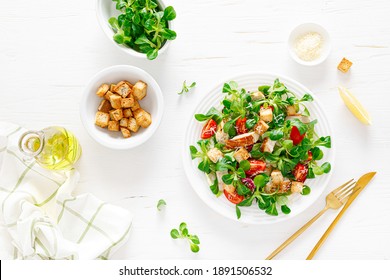 Caesar Salad With Grilled Chicken Meat, Fresh Tomato, Croutons, Lambs Lettuce And Parmesan Cheese. Healthy Lunch. Top View