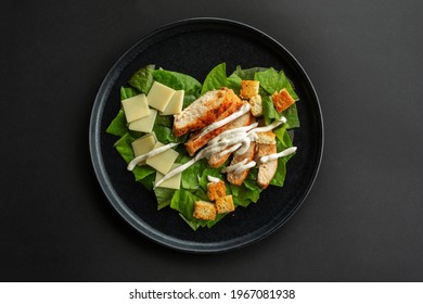 Caesar Salad In Heart Shape Love Food Concept, Black Stone Luxury Plate, Top View Flat Lay Design, Black Background