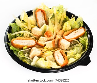 Caesar Salad With Lettuce, Croutons, Parmesan And Chicken Breast In Plastic Bowl Isolated On White Background