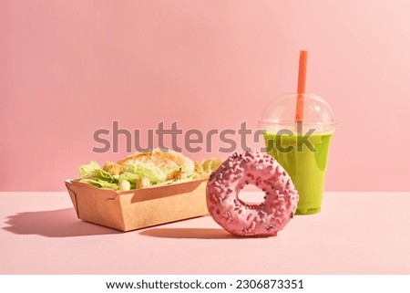 caesar salad in paper box, donut and matcha in plastic cap