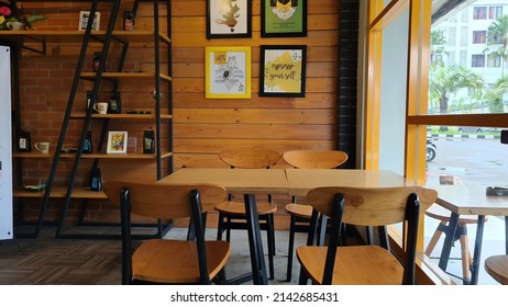 Cafe Bar Restaurant Nobody Indoor. Empty Coffee Shop Interior Daytime With Wooden Design Counter Red Brick Wall In Background. Cafe With Beautiful Letters  In Surabaya,  Indonesia On April 4, 2022