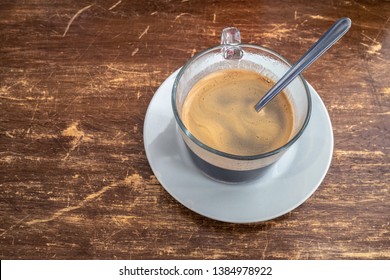 Cafe Cubano in in a glass mug on a wooden table