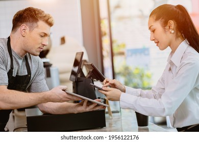 Cafe Customer Using Mobile Internet Banking Scan QR Payment Code For Coffee Drink From Barista Staff At The Counter, Cashless Society Modern Lifestyle Concept