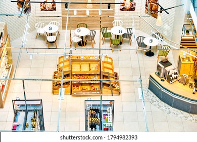 Cafe In Grocery Store Supermarket Interior. Top Down View Of Cafeteria Seating Area. Inside Of Local Shop. Various Products And Drinks At Counter View From Above In Mall In Moscow Russia On July 2020
