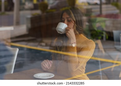 Cafe Interior Having A Cup Of Coffee, Lifestyle And Break With Drinks, Young Woman With Long Hair, Window Reflection