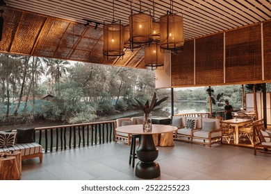 The Cafe Interiors are presented in different things- chairs,sofa's,tables, hanging lamps. the wooden modern interior of the beautiful cafe beside the lake and decorated in classic way for customers.