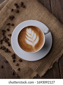 Cafe Latte, a coffee drink made with espresso and steamed milk. The word comes from the Italian caffé e latte, cafelatte or caffellatte, which means "coffee and milk".