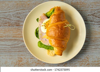 Cafe Menu Template: Top View Of Croissant Ham Sandwich With Egg And Salad On A Plate. Close Up