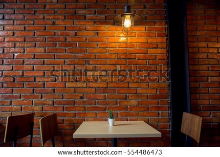 Cafe or Restaurant Decorate with Red Brick Wall and Industrial loft lamp