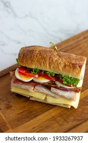 Cafe - Sandwich with bacon, cheese, ham and vegetables