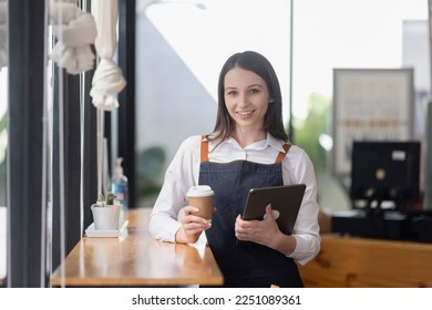 Cafe shop partners and Welcoming, Beautiful Young Cafe Owner.   - Shutterstock ID 2251089361