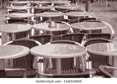 Cafe Table And Chairs, Malmo, Sweden In Black And White Sepia Tone