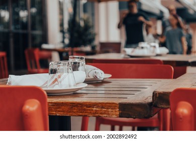 Cafe Table On Urban City Downtown Sidewalk Outside Restaurant In The Summer