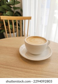 cafelatte in cafe : Café Latte is a popular coffee drink made with espresso and steamed milk, topped with a thin layer of foam