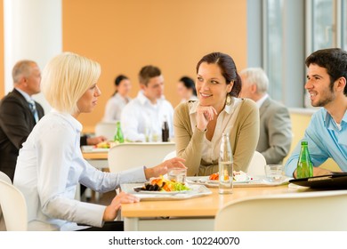 Cafeteria lunch young business people eat salad at office canteen - Powered by Shutterstock