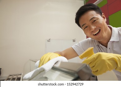 Cafeteria Worker Cleaning Food Serving Area