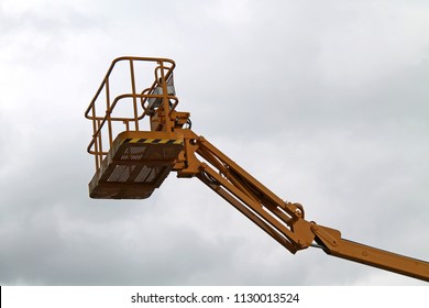 The Cage And Arm Of An Hydraulic Lift Cherry Picker.