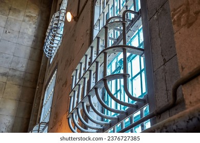 Caged windows at the former Alcatraz Penitentiary in San Francisco, California. - Powered by Shutterstock