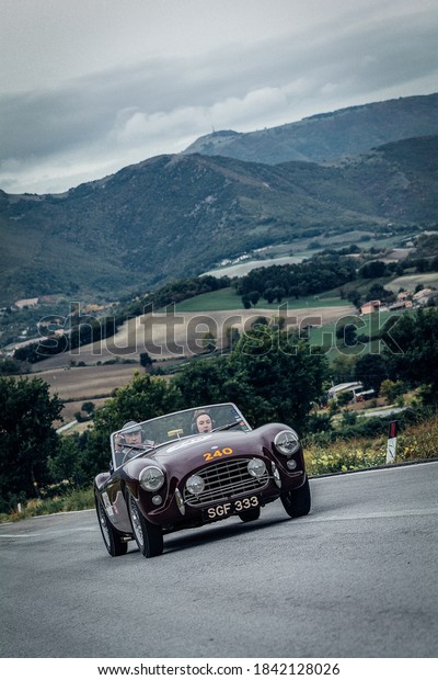 CAGLI , ITALY - OTT 24 - 2020 : AC ACE 1955\
on an old racing car in rally Mille Miglia 2020 the famous italian\
historical race\
(1927-1957)