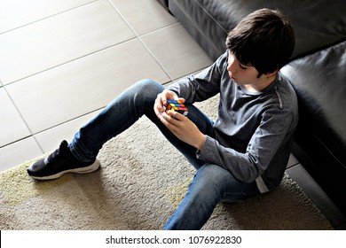 Cagliari / Italy - April 25 2018:  Kid Enjoying Rubik's Cube