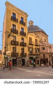 CAGLIARI, SARDINIA, ITALY - JUL 08, 2016: An old house with a beautiful facade and a church in the historic part of the city
 - Shutterstock ID 739051297