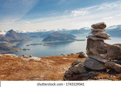 Cairn (a pile of stones) marking mountain hiking trail in Norway.