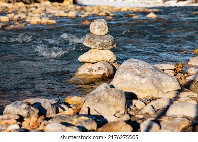 Cairn In A Little River On Sunset