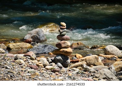 Cairn Near A Mountain Stream In Filisur In Early Summer. Fresh Flowing Water. Landwasser. High Quality Photo