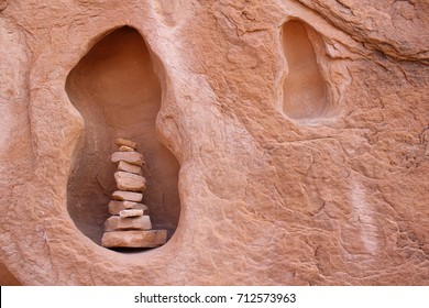 Cairn Stacked In A Rock Face Recess.