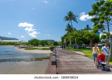 Cairns, Australia - October 15, 2009: A Family Walking On Wooden Sidewalk Near The Tropical Beach