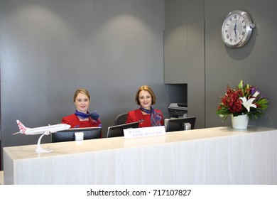 CAIRNS, AUSTRALIA – OCTOBER 31 2013: Unidentified Virgin Australia Employees Welcomes Guests Into The Airline's New Lounge At Cairns Airport.