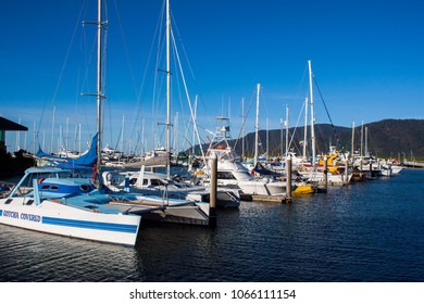 CAIRNS, QUEENSLAND, AUSTRALIA - 19 AUGUST 2011: Sailing Boats Moored In The Cairns Marina On A Sunny Day Under A Bright Blue Sky.