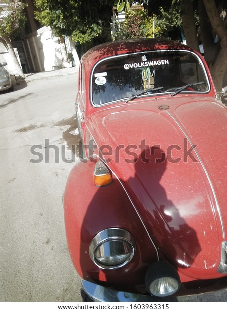 Cairo / Egypt - 1.2:2020: Red classic\
Volkswagen car in the street of Cairo city -\
Egypt