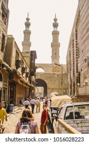 Cairo, Egypt - 2008 - People walking towards Bab Zuweila, one of the remaining gates of the Old City of Islamic Cairo, known as Bawabbat al-Mitwali during the Ottoman period, spelled Bab Zuwayla, 