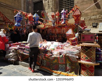 Cairo, Egypt. 26 March 2019. Shop in Bab Zuweila selling colorful decorations for Ramadan month such as fanoos (lantern), banner and traditional fabrics.