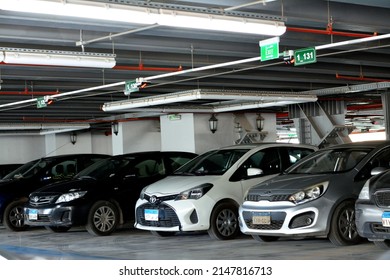 Cairo, Egypt, April 14 2022: Parked cars inside a multilevel parking car lot building, selective focus of modern cars inside a closed parking lot garage in Egypt