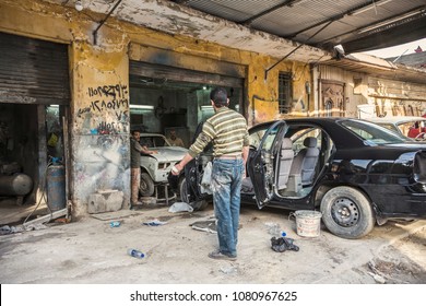 CAIRO, EGYPT - April 2018: Car Repair Service At Old Cairo Town, Man Fixing Old Cars In Car Repair Garage In Cairo City, Egypt