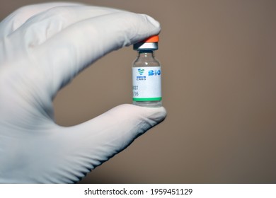 Cairo, Egypt, April 21, 2021. A medical personnel that holds a Sinopharm COVID-19 vaccine bottle dose , Sars-Cov-2 Vaccine inactivated vero cell, Sinopharm is a Chinese state-owned company