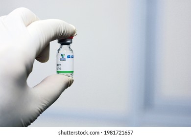 Cairo, Egypt, April 28, 2021. A medical personnel that holds a Sinopharm COVID-19 vaccine bottle dose , Sars-Cov-2 Vaccine inactivated vero cell, Sinopharm is a Chinese state-owned company