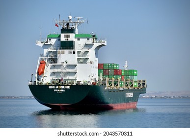 Cairo, Egypt -April 28, 2021- A Cargo Ship Is Sailing From The Suez Canal To International Waters,evergreen,panama Ship