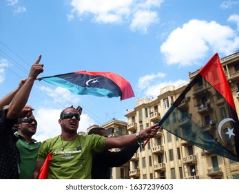 CAIRO, EGYPT - April 8 2011- The Arab Spring Revolution -  Protesters Support Libyan Protests Against The Regime Of Muammar Gaddafi - Tahrir Square, Egypt, Libya Flag        