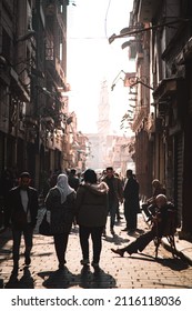 Cairo Egypt December 2021 Streets Of Cairo, Egypt. People Walking With A Mosque In The Distance, Street Vendor Selling Their Items. Cold Winter Day