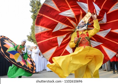 CAIRO, EGYPT, JANUARY 23 2016: The whirling dervish of Al Tannoura Folklore Troupe, Cairo, Egypt during the  International Folklore Festival held in the city center.