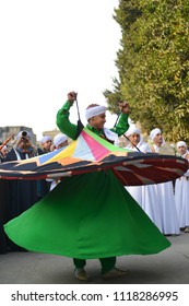 CAIRO, EGYPT, JANUARY 23 2016: The whirling dervish of Al Tannoura Folklore Troupe, Cairo, Egypt during the  International Folklore Festival held in the city center.