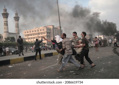 Cairo,  Egypt - July 03 2013:Thousands Of Protesters Flocked To Tahrir Square In Cairo. People Were Killed And Injured By The Tear Gas And Rubber Bullets Of The Riot Police.