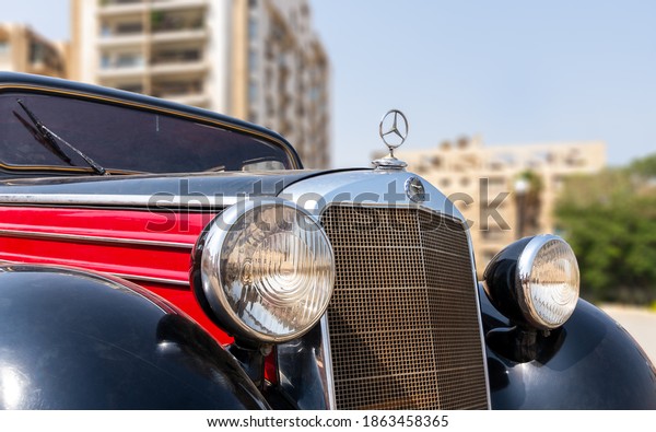 Cairo, Egypt- July 29 2020: 1953 Black and red\
Mercedes antique car, displayed in front of Baron Empain Palace,\
located in Heliopolis\
District