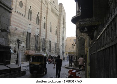 Cairo, Egypt, June 2021. Egyptian morning activities around historic buildings that provide a place for buying and selling. with old buildings designed by old architecture. during the ancient Islamic.